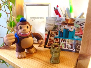 That's Freddie the MailChimp with my "work" vision board and a lucky Buddha for abundance!